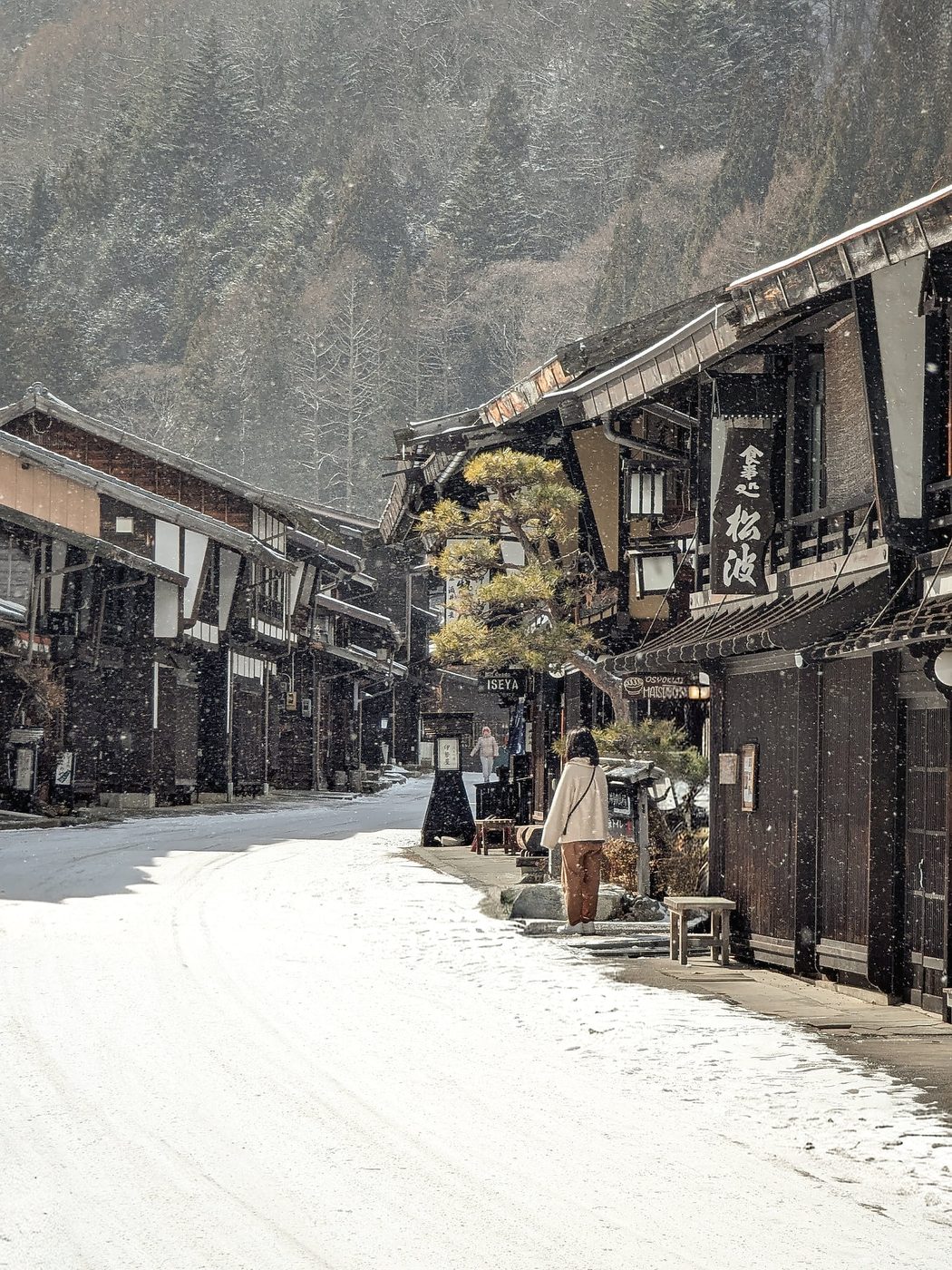 Snow falling on the old timber post town of Narai-juku in Nagano, Japan