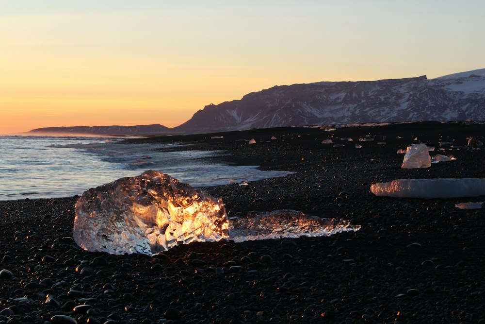 A fragment of glacier ice on the black sand at Jökulsárlón